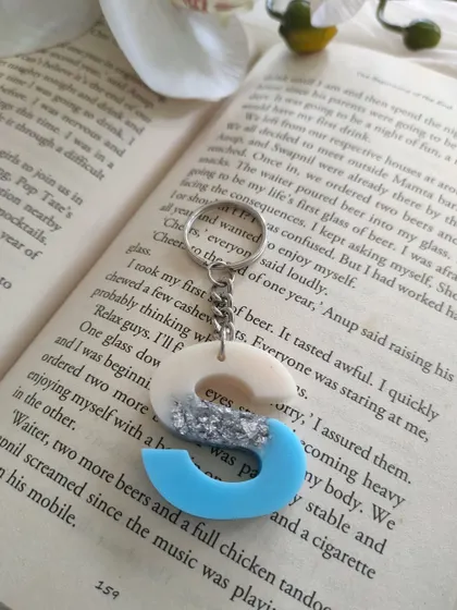 This 'S' initial keychain features a three-tone design with sky blue, silver flakes, and pearl white. I love creating these custom color combinations.