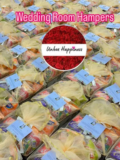 Another view of the bulk wedding room hampers, each wrapped in delicate netting with a personalized thank you note.