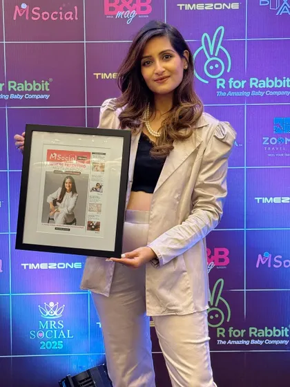 Feeling proud after receiving an award in the educator creator space while pregnant. This journey has been about growing both my family and my passion.