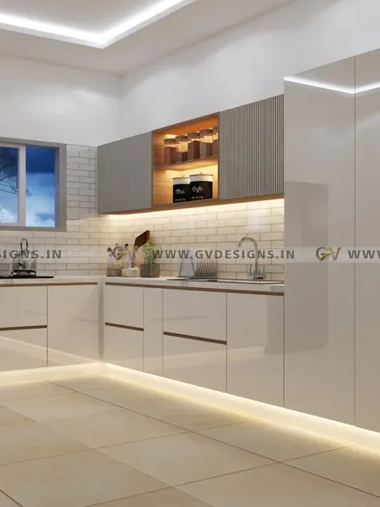 This kitchen blends glossy frosty white laminate with textured fluted laminate on the wall units. The design includes an open tall unit for display, wooden ledges for easy access, and hidden handles for a clean, seamless aesthetic.