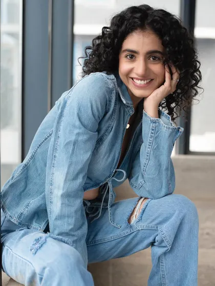 A smiling shot that shows how a great minimal makeup look can boost confidence and radiate happiness.