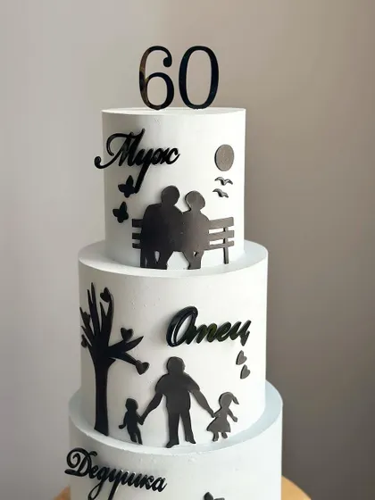 A close-up of the beautiful silhouette details on the 60th birthday cake.