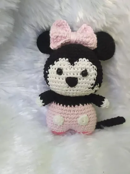 With all the Barbie craze, here is my own little touch of pink with this adorable Minnie Mouse. Her pink outfit and bow are crocheted with soft cotton yarn, making her a sweet and stylish friend.
