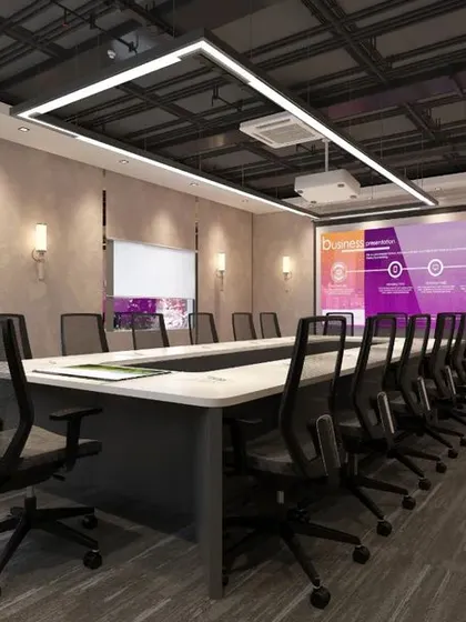 The main conference room at the Mahalakshmi Logistics office. This room is fully equipped for presentations with a projector screen, whiteboard, and flexible seating, all framed by modern wood paneling and sophisticated wall sconces.