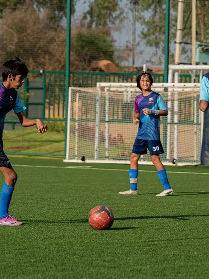 Players enjoying a small-sided game, a great way to improve skills in a fun, competitive setting.