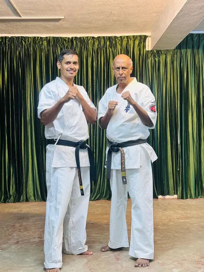 A moment of mutual respect with a senior karateka at our camp. We are always learning from each other.