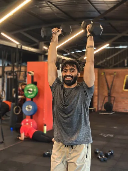 Locked in and focused. These shots capture the intensity and determination of our members during their workouts, from band work and deadlifts to dumbbell presses and rowing.