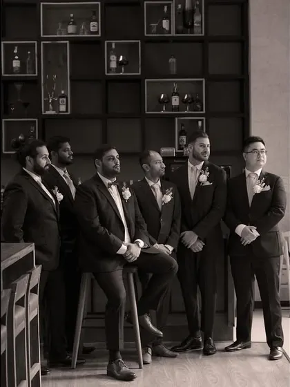 A classic, dapper portrait of the groom and his groomsmen in black and white.
