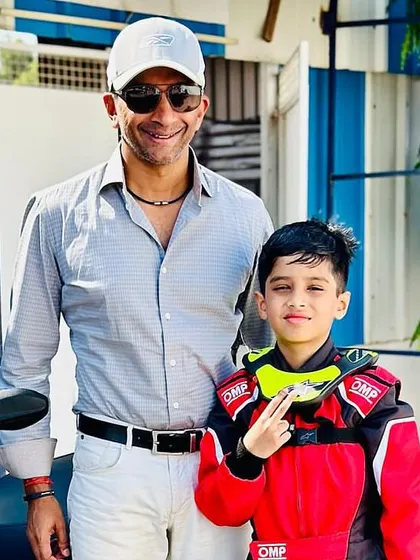 A young driver poses with his hero, Indian racing legend Narain Karthikeyan. These moments are incredibly inspiring for the next generation.
