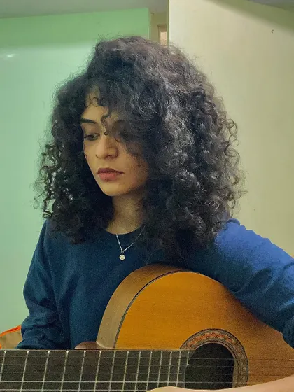 Another guitar selfie, capturing the focused look before a take.