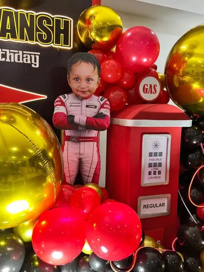 A close-up of the personalized cutout and the 3D gas pump prop, adding a fun, realistic touch.