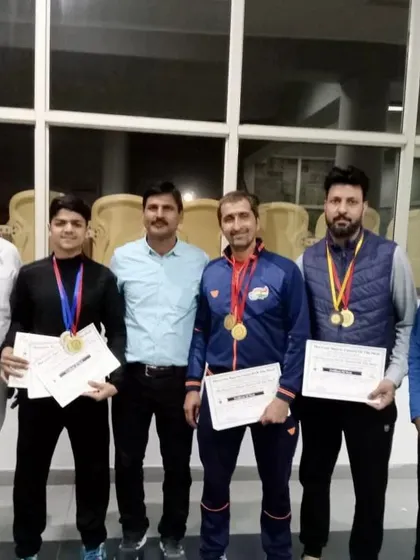 A group of adult players showcasing their medals. It proves that anyone can achieve success with the right training and dedication.