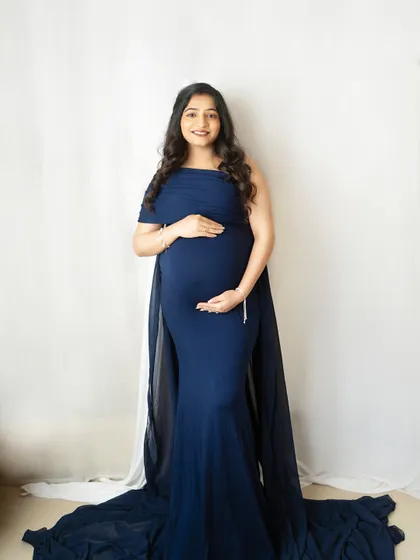 The original, unedited studio portrait in a navy blue gown. This shows the quality of the lighting and posing before any digital artistry is applied.