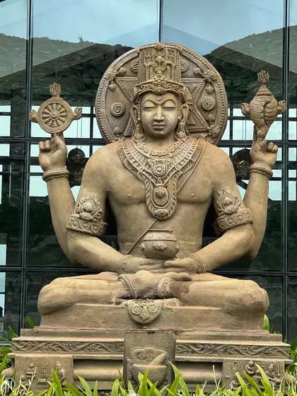 A close-up of the Lord Dhanvantari statue, the divine healer and god of Ayurveda. His statue at our entrance welcomes all who seek health and well-being.
