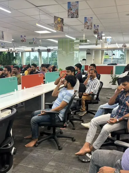 A group of employees at MagicBricks fully engaged in a breathing exercise. My sessions are designed to be inclusive and beneficial for everyone.