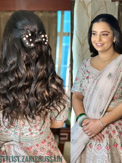 A sweet and playful half-updo featuring a bow made of hair and adorned with pearls. This is a unique and charming style for a pre-wedding event.