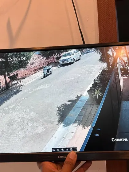 Monitoring the public road outside the property to keep an eye on any approaching vehicles or people.