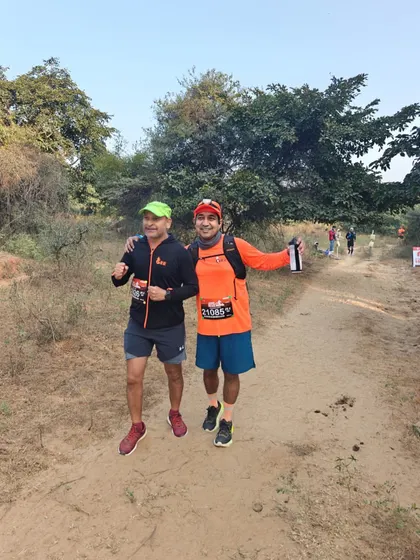 Conquering the Aravalis. Two of our runners on the trail, supporting each other through the tough terrain.