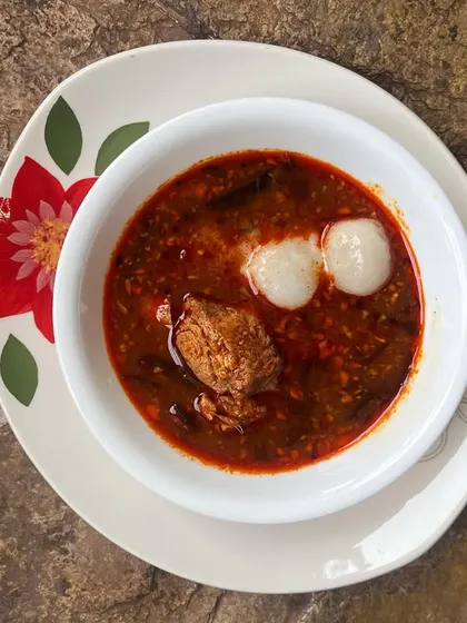 An everyday Red Fish Curry, a staple in any Kerala home. Here, it's served with Pidi (rice dumplings) for a simple, satisfying lunch that is full of authentic flavor.