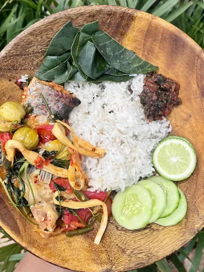 A simple, wholesome meal of fish cooked with bitter eggplant, served with steamed rice, chutney, and foraged greens. This is farm-to-table cooking at its best, full of the flavors we grew up with.