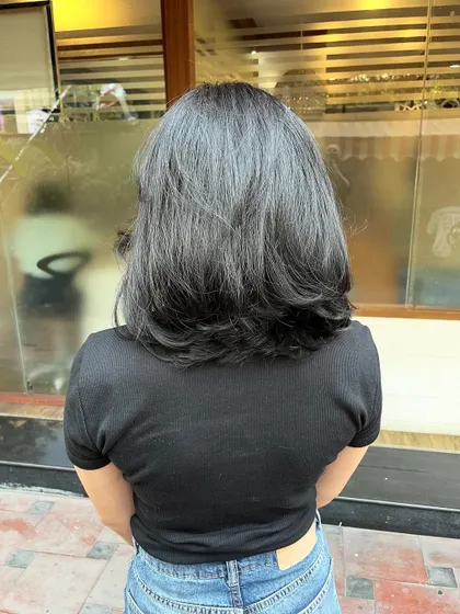 The back view shows how layers can make fine hair appear more dense.