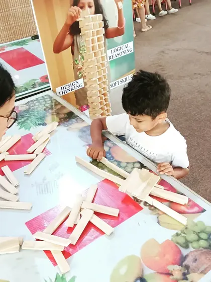A mentor and child exploring ideas together. This interaction is key to building confidence. A simple question or suggestion can unlock a new way of thinking, helping a child overcome a block and continue their creative journey.