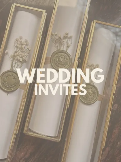 For a touch of timeless elegance, I create these scroll invitations housed in beautiful glass and brass boxes. They are adorned with dried flowers and a custom wax seal for a royal feel.
