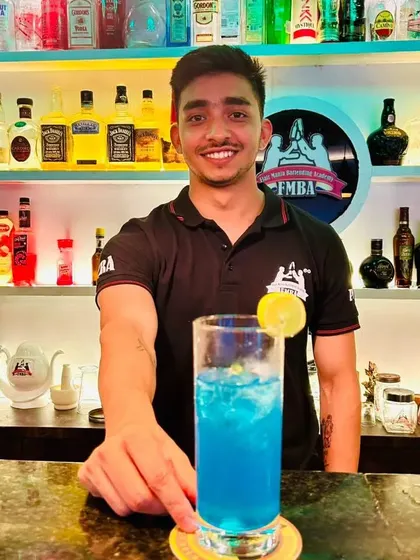 A tall, refreshing blue mocktail, a perfect and fun option for guests of all ages.