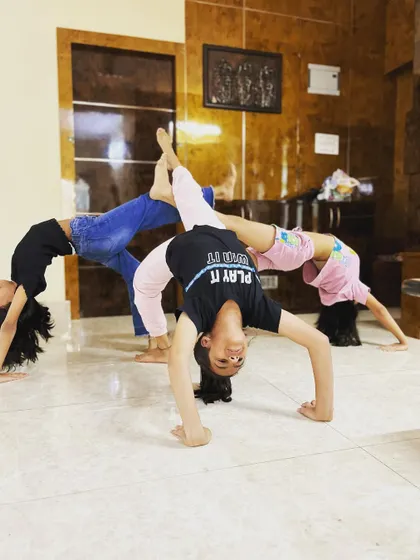 A duplicate of image 117, showing the fun and creative group poses we practice.