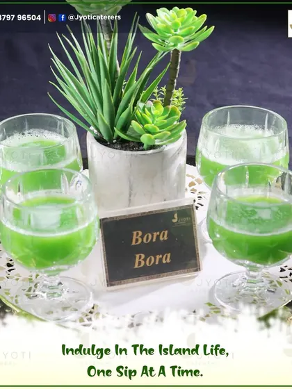 Refreshing 'Bora Bora' mocktails served in elegant glassware, offering guests a vibrant and tropical taste of island life.