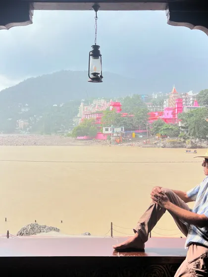 Taking a moment to gaze at the river from a quiet window in Rishikesh. These pauses are just as important as the practice itself, allowing for integration and reflection.