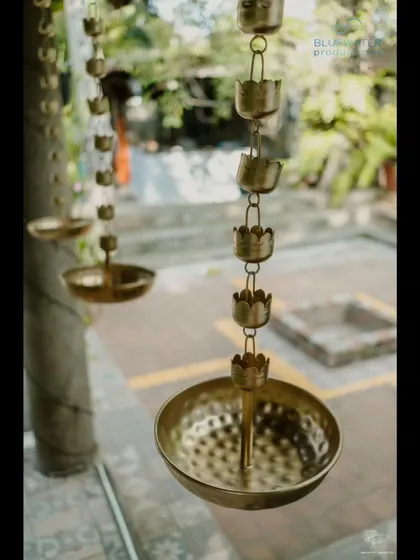 A close-up of traditional hanging brass lamps.