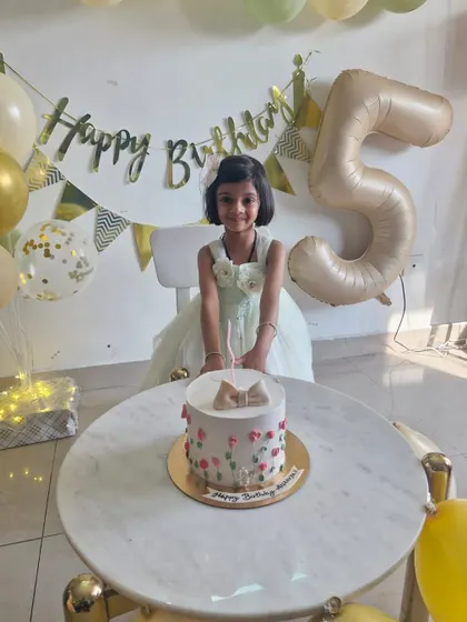 The best part of our job is seeing the smiles on our clients' faces. Here's a happy birthday girl with her spring-themed cake.