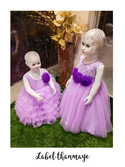 A set of matching lavender party frocks for sisters of different ages.