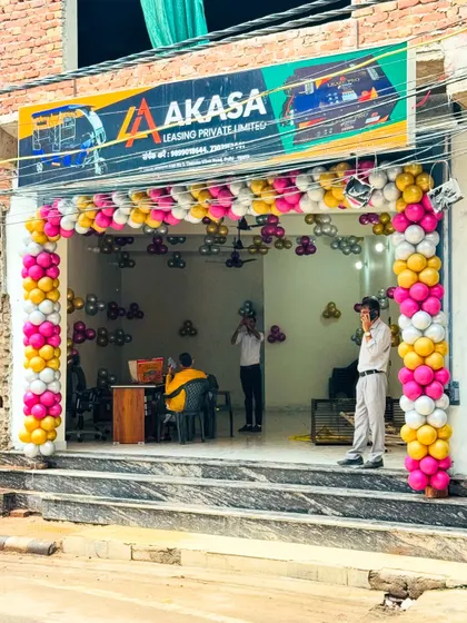 A full view of the storefront decorated for the grand opening of "AKASA Leasing Private Limited".