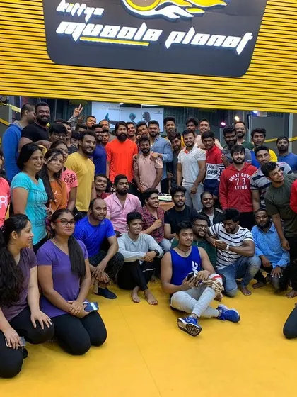 A group photo with our gym family at Kitty's Muscle Planet. This is what it's all about: a community of people committed to their health and fitness goals.