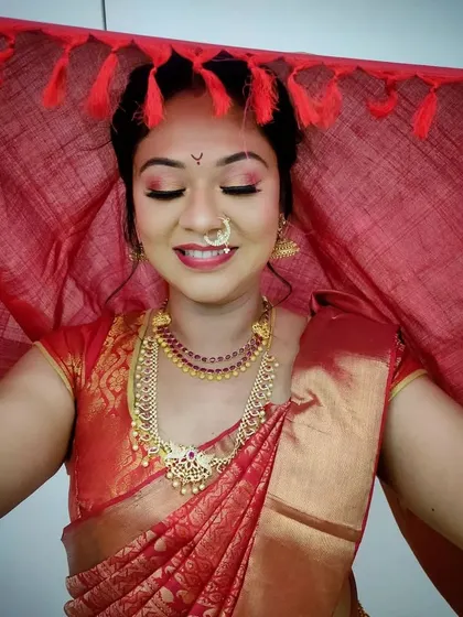 Our advanced bridal makeup course includes detailed training on regional looks, like this traditional South Indian bridal style. Students master techniques for vibrant eye makeup and learn to work with traditional attire and jewelry.