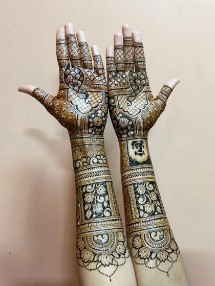 A different angle of this stunning bridal mehndi, showcasing the detailed work that goes up the arm.
