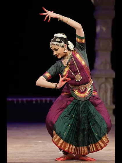 A pose that combines intricate hand gestures with a strong body posture, typical of the narrative sections in my performances.