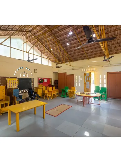 A duplicate of image 51, showing the interior of the Spastic Society classroom.