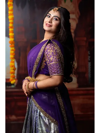 A happy, smiling portrait that captures the festive spirit of this traditional outfit.