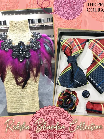 A bold and glamorous gift set. The men's accessories feature a red and yellow plaid pattern, while the women's statement collar is adorned with dramatic pink feathers and black crystal clusters.