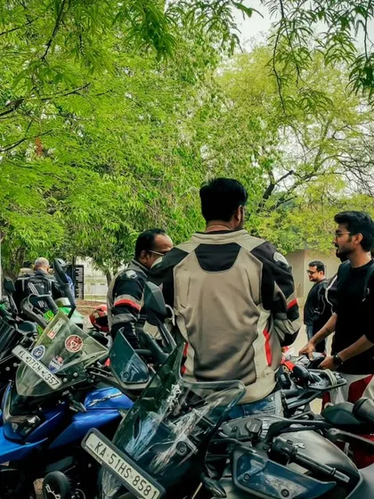 Members gathered around the bikes, sharing stories and passion. This is the heart of our community.