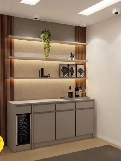 A detailed look at the custom-built bar unit, showing the combination of closed storage, a wine fridge, and backlit display shelves.