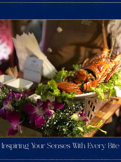 For a truly luxurious offering, we present this stunning grilled lobster appetizer. The lobster is beautifully arranged with fresh greens and flowers, creating a show-stopping dish that is sure to impress your guests.