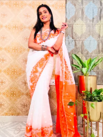 A lovely white and orange Jamdani saree. The colors are bright and cheerful, and the traditional weave is just beautiful.