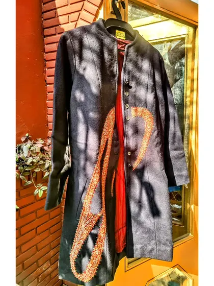 This is a perfect example of upcycling with a touch of history. I used a 400-year-old antique Jamevar patch and placed it on a classic navy woollen coat. The result is a completely unique, statement winter piece with a story to tell.