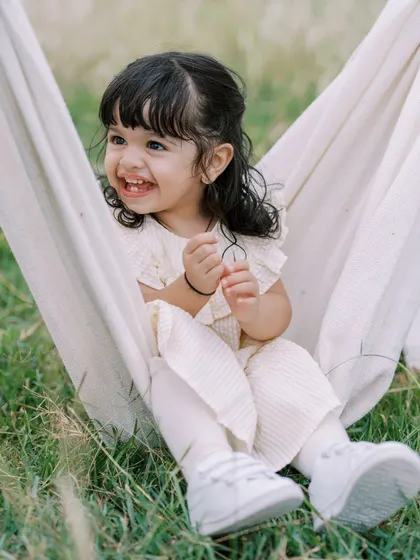 A girl's infectious laugh as she plays in a makeshift swing. These are the moments of pure, unscripted joy.