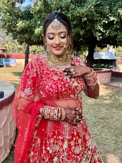 A close-up of the bride, showing the intricate details of her makeup and her joyful expression.