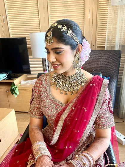 The bride's smile says it all. She looks happy and beautiful, ready for her ceremony.